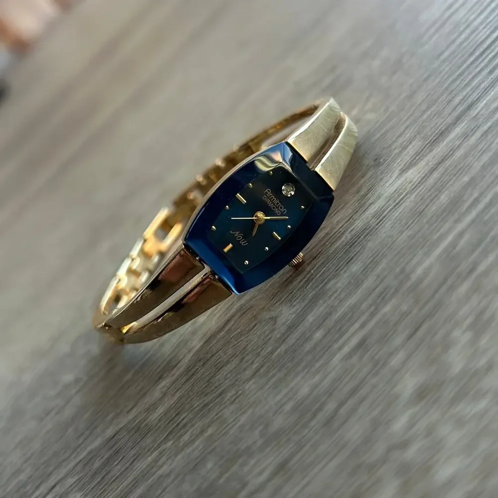 Armitron Diamond Now Blue Dial Gold Tone Bangle Watch